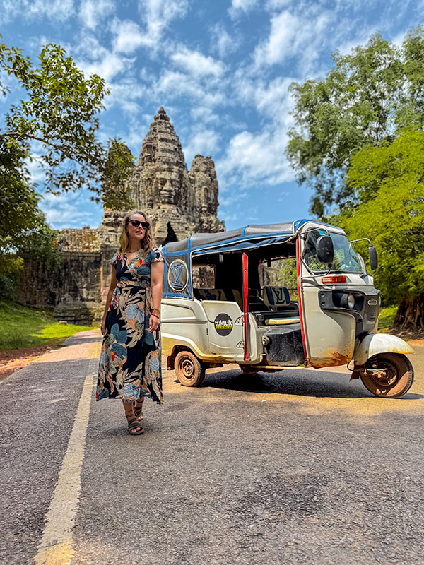 Katie walking away from our rented tuktuk at Tonle Om gate, Angkor Thom