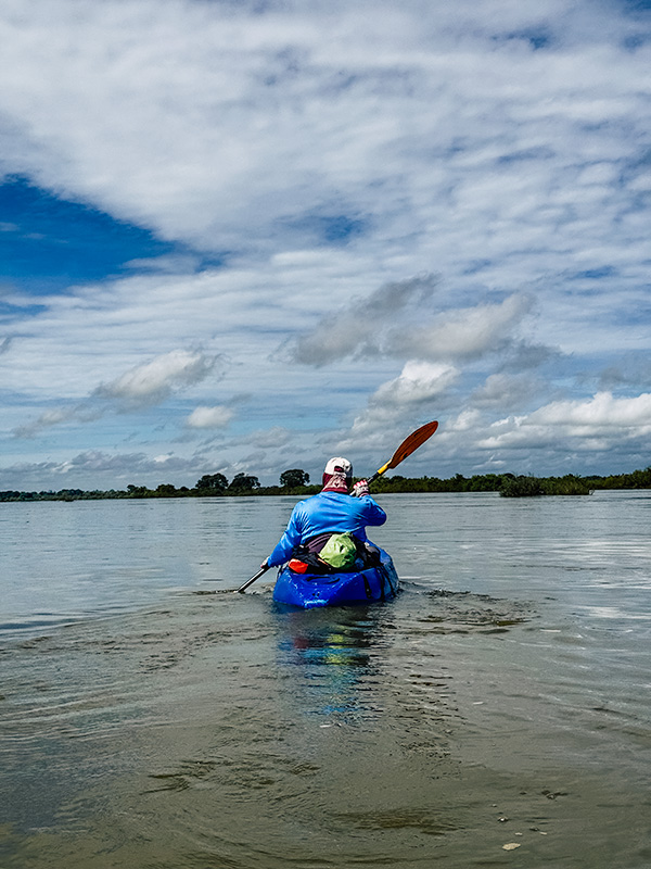 Lucky (tour guide) kayaking to see dolphins in Kratie, Cambodia