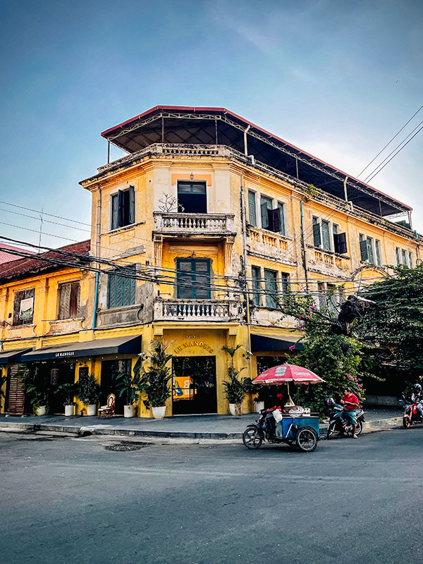 Vendors and motorcyclists on the streets of Phnom Penh, Cambodia
