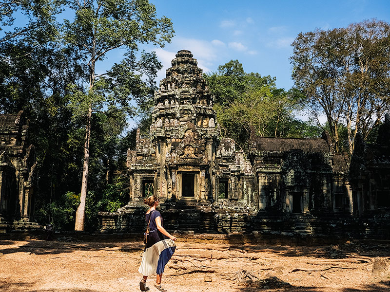 Katie standing in front of a temple in Angor Thom, Siem Reap, Cambodia