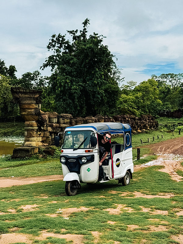 Matt popping his head out of tuktuk at Banteay Chhmar